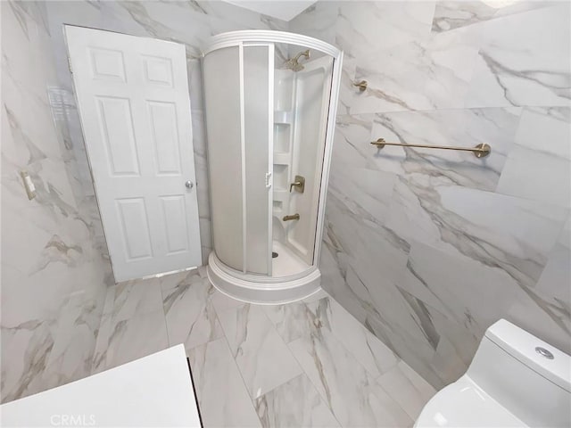 13827 Olathe Rd, Apple Valley, CA 92307 - bathroom featuring a marble finish shower, toilet, and marble finish floors
