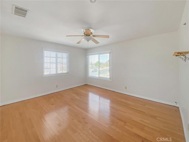 13827 Olathe Rd, Apple Valley, CA 92307 - empty room featuring wood finished floors, ceiling fan, and baseboards