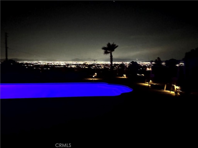 13827 Olathe Rd, Apple Valley, CA 92307 - view of pool at night