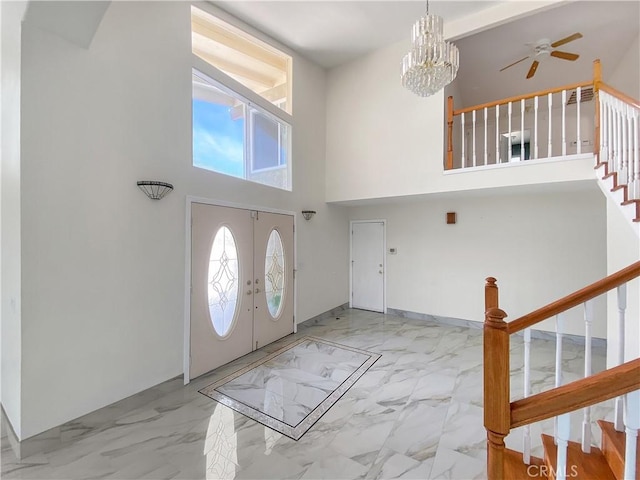13827 Olathe Rd, Apple Valley, CA 92307 - entrance foyer featuring stairway, marble finish flooring, a chandelier, a towering ceiling, and a ceiling fan
