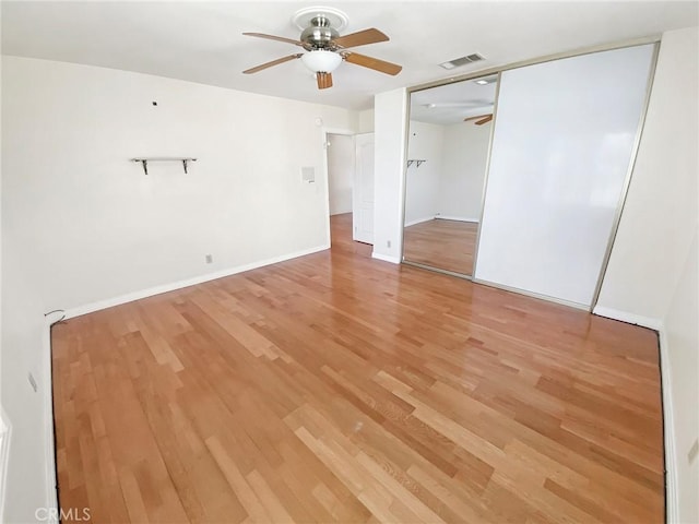 13827 Olathe Rd, Apple Valley, CA 92307 - unfurnished bedroom featuring light wood-type flooring, baseboards, a closet, and ceiling fan