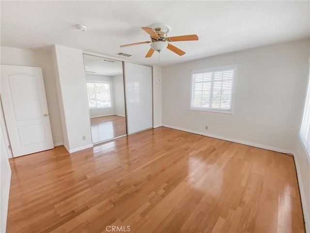 13827 Olathe Rd, Apple Valley, CA 92307 - unfurnished bedroom featuring light wood finished floors, baseboards, a closet, and ceiling fan