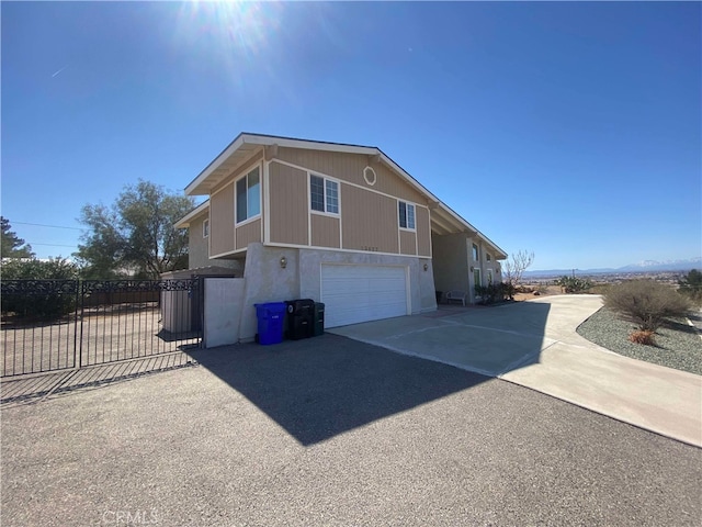 13827 Olathe Rd, Apple Valley, CA 92307 - view of home's exterior with concrete driveway, fence, and an attached garage