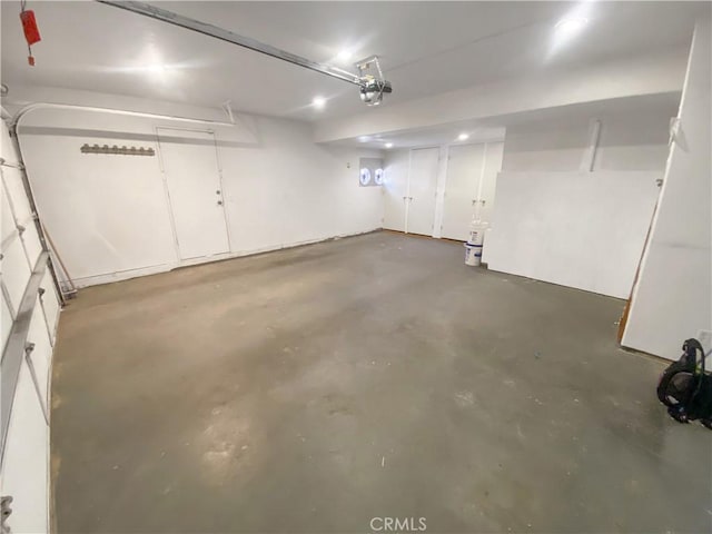 13827 Olathe Rd, Apple Valley, CA 92307 - garage featuring a garage door opener