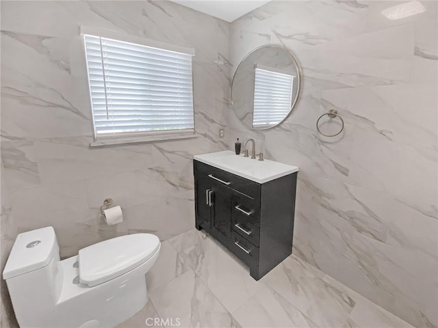 13827 Olathe Rd, Apple Valley, CA 92307 - half bath featuring tile walls, toilet, and vanity