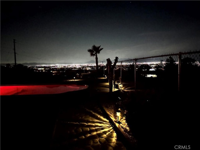 13827 Olathe Rd, Apple Valley, CA 92307 - patio at night featuring fence