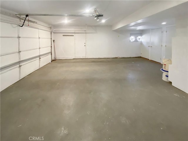 13827 Olathe Rd, Apple Valley, CA 92307 - garage featuring a garage door opener