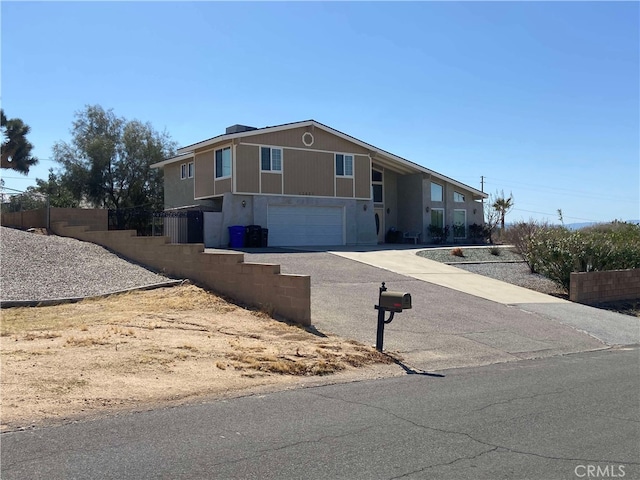 13827 Olathe Rd, Apple Valley, CA 92307 - view of front of property with concrete driveway and a garage