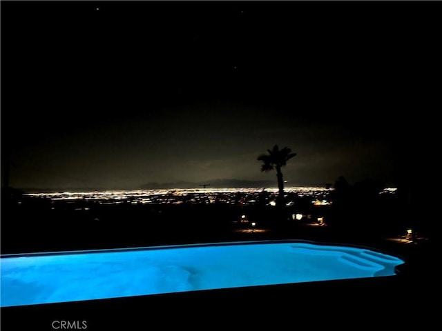 13827 Olathe Rd, Apple Valley, CA 92307 - pool at twilight with an outdoor pool