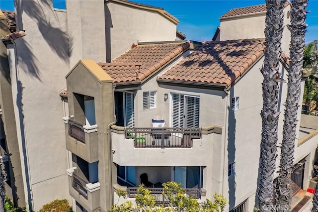 310 Lake St Unit 216, Huntington Beach, CA 92648 - exterior space with stucco siding and a tiled roof