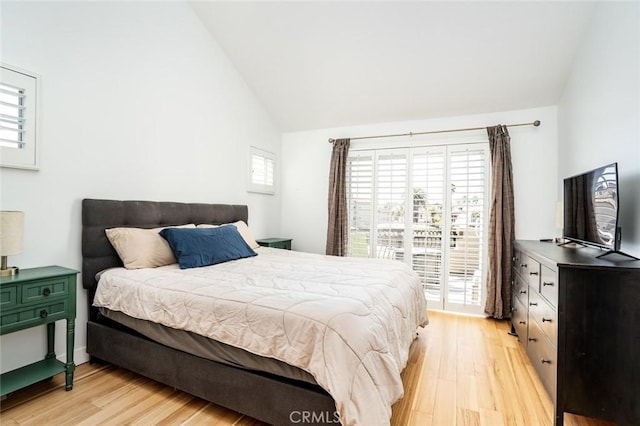 310 Lake St Unit 216, Huntington Beach, CA 92648 - bedroom featuring access to exterior, high vaulted ceiling, and light wood-type flooring