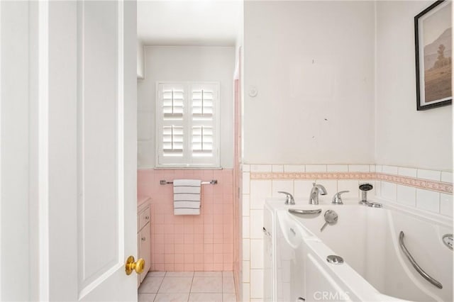 full bathroom featuring tile patterned floors, a wainscoted wall, tile walls, and a garden tub