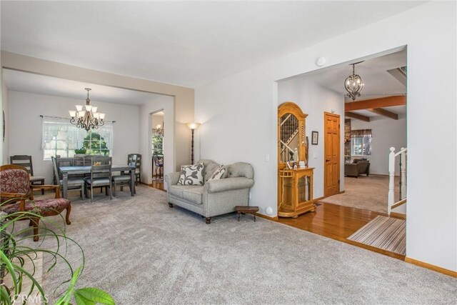 6180 Cedar Ave, Angelus Oaks, CA 92305 - carpeted living area featuring a chandelier and beam ceiling