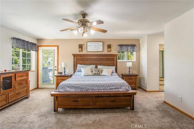 6180 Cedar Ave, Angelus Oaks, CA 92305 - carpeted bedroom featuring access to outside, multiple windows, and ceiling fan