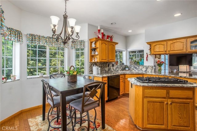6180 Cedar Ave, Angelus Oaks, CA 92305 - kitchen with gas cooktop, black dishwasher, a chandelier, brown cabinets, and recessed lighting