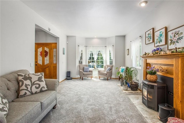 6180 Cedar Ave, Angelus Oaks, CA 92305 - living room featuring light carpet and a wood stove