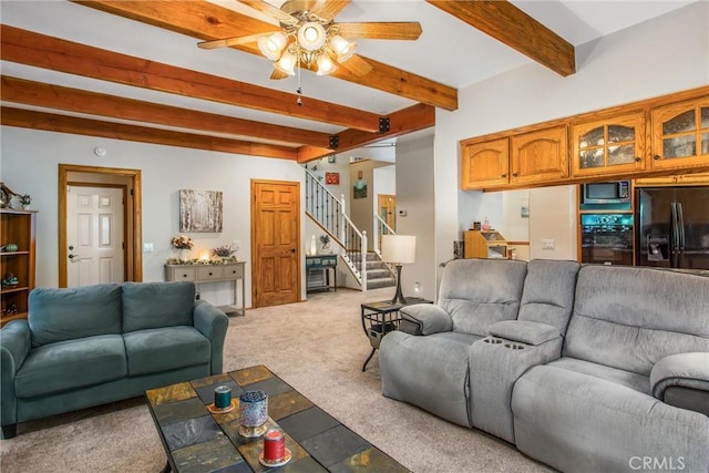 6180 Cedar Ave, Angelus Oaks, CA 92305 - carpeted living room featuring stairway, beamed ceiling, and a ceiling fan