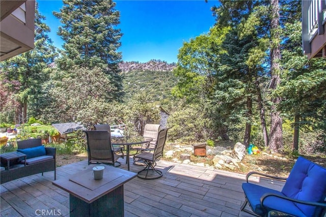 6180 Cedar Ave, Angelus Oaks, CA 92305 - view of patio featuring outdoor dining space and an outdoor hangout area