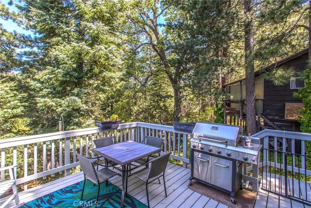 6180 Cedar Ave, Angelus Oaks, CA 92305 - deck with area for grilling and outdoor dining area