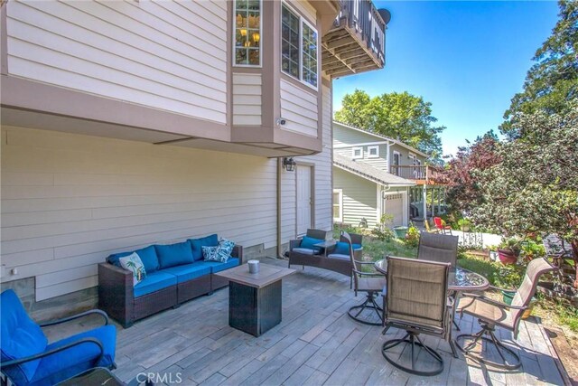 6180 Cedar Ave, Angelus Oaks, CA 92305 - wooden terrace with an outdoor hangout area and outdoor dining space