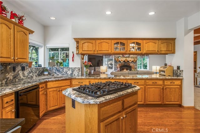 6180 Cedar Ave, Angelus Oaks, CA 92305 - kitchen featuring black appliances, brown cabinetry, light stone countertops, and recessed lighting