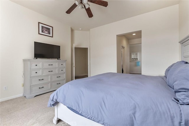 bedroom featuring a ceiling fan, baseboards, and light colored carpet