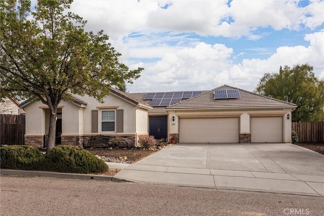 ranch-style house with stone siding, stucco siding, and a garage