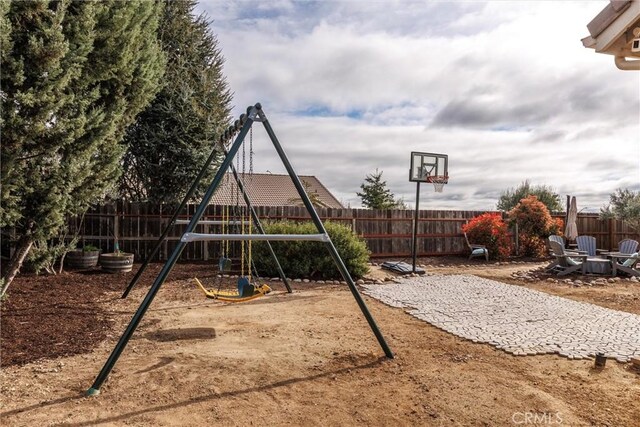 view of jungle gym featuring a fenced backyard
