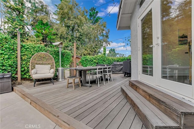 wooden deck with outdoor dining space