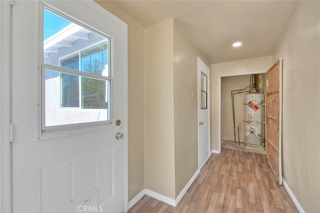 4026 Toland Way, Los Angeles, CA 90065 - hallway featuring strapped water heater, light wood-style flooring, plenty of natural light, and recessed lighting