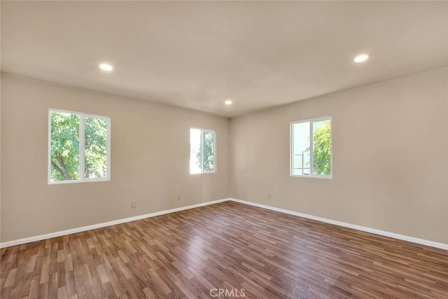 4026 Toland Way, Los Angeles, CA 90065 - unfurnished room with wood finished floors, baseboards, and recessed lighting