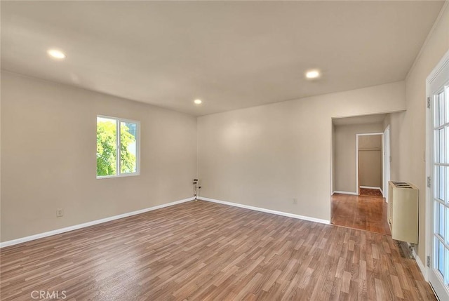 4026 Toland Way, Los Angeles, CA 90065 - spare room with wood finished floors, baseboards, recessed lighting, and heating unit