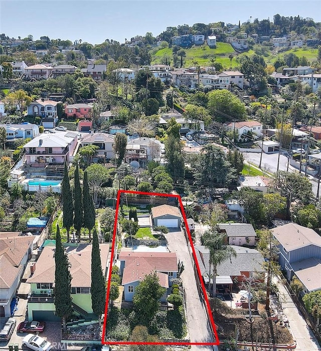 4026 Toland Way, Los Angeles, CA 90065 - aerial view of property and surrounding area with property parcel outlined and nearby suburban area