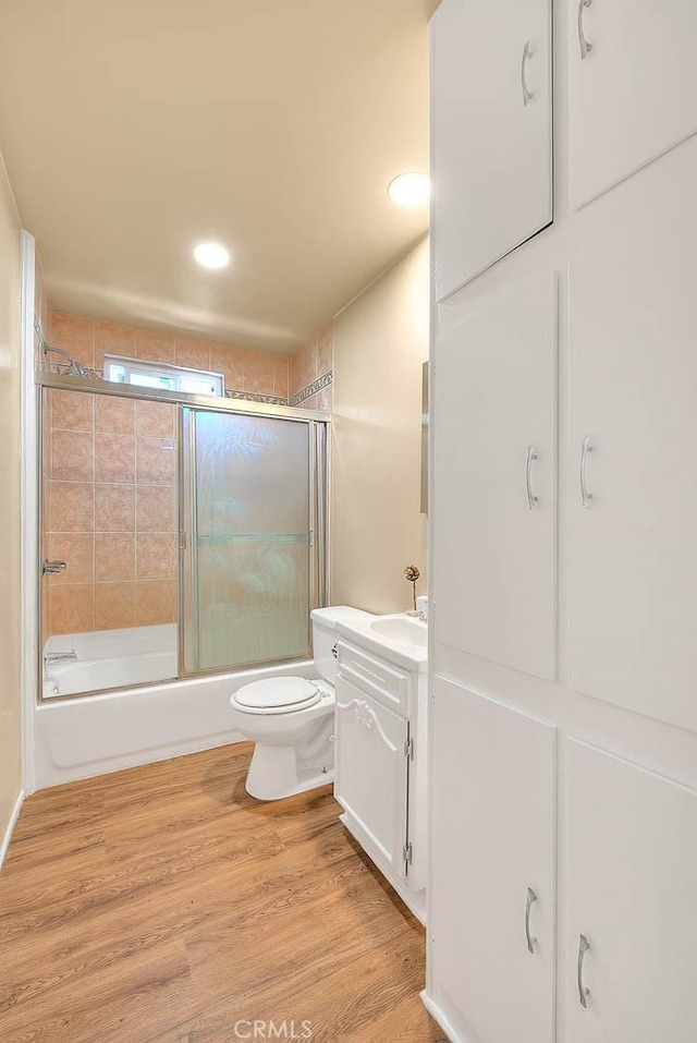 4026 Toland Way, Los Angeles, CA 90065 - bathroom featuring enclosed tub / shower combo, vanity, wood finished floors, toilet, and recessed lighting