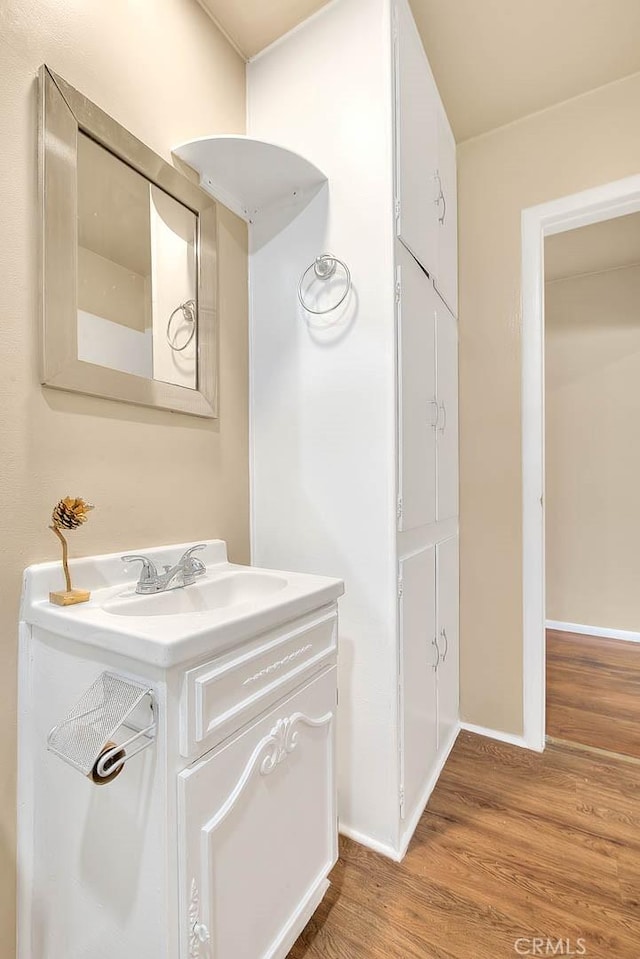 4026 Toland Way, Los Angeles, CA 90065 - bathroom with wood finished floors, vanity, and baseboards