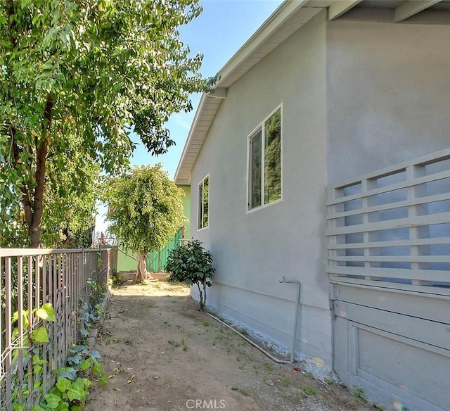 4026 Toland Way, Los Angeles, CA 90065 - view of side of home featuring fence and stucco siding