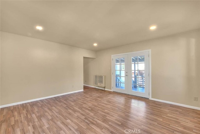 4026 Toland Way, Los Angeles, CA 90065 - unfurnished room with french doors, light wood-type flooring, baseboards, recessed lighting, and heating unit