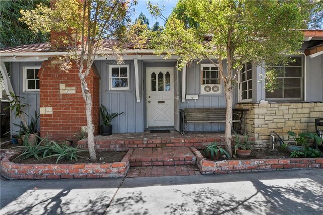 21032 Baltar St, Canoga Park, CA 91304 - view of exterior entry featuring board and batten siding