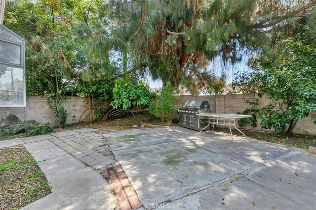 21032 Baltar St, Canoga Park, CA 91304 - view of patio / terrace with a grill and a fenced backyard