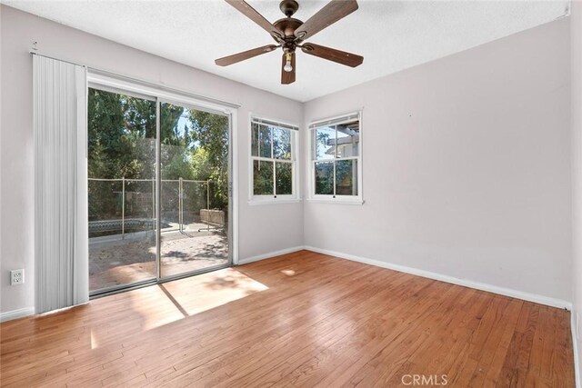 21032 Baltar St, Canoga Park, CA 91304 - empty room with hardwood / wood-style floors, baseboards, and a ceiling fan