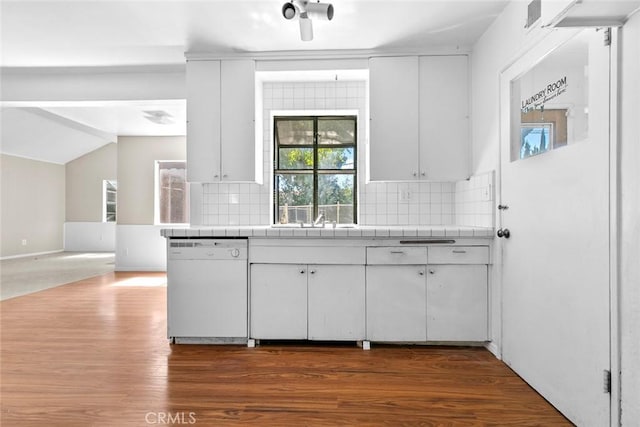 21032 Baltar St, Canoga Park, CA 91304 - kitchen with decorative backsplash, white cabinets, dark wood finished floors, lofted ceiling, and white dishwasher
