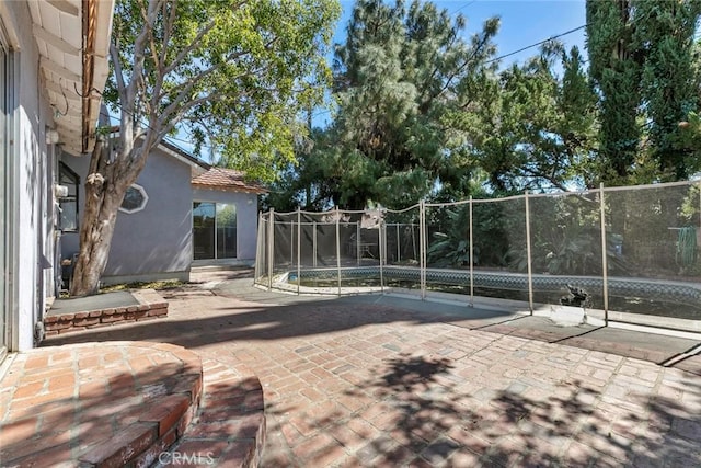 21032 Baltar St, Canoga Park, CA 91304 - exterior space with a trampoline, fence, and a patio area