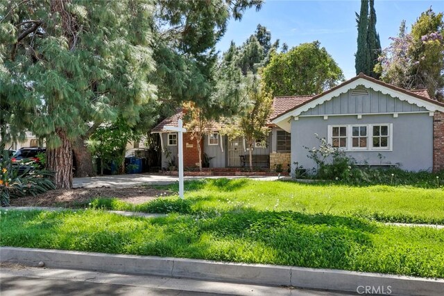 21032 Baltar St, Canoga Park, CA 91304 - view of front of home with stucco siding and a front yard