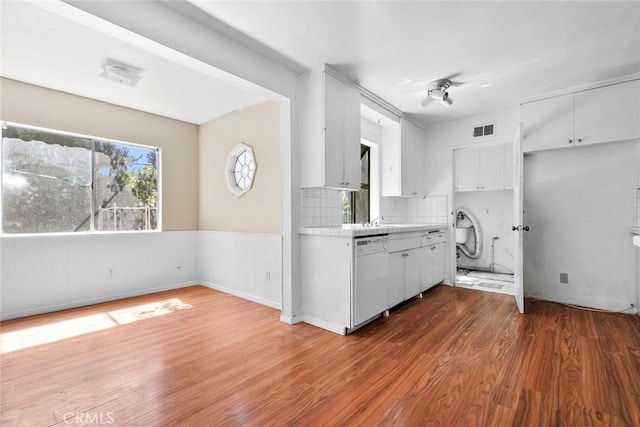 21032 Baltar St, Canoga Park, CA 91304 - kitchen featuring light countertops, visible vents, white cabinets, dishwasher, and wood finished floors
