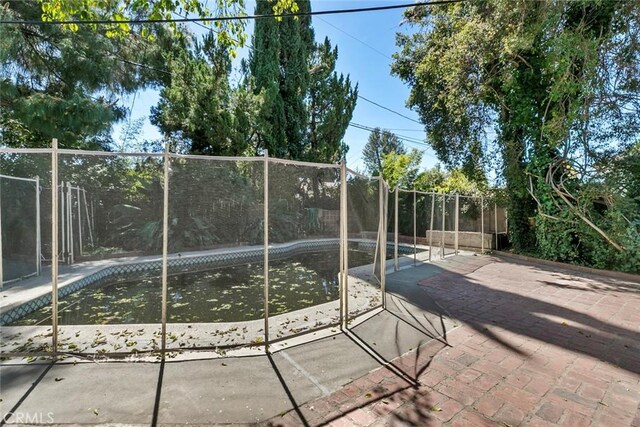 21032 Baltar St, Canoga Park, CA 91304 - outdoor pool featuring a patio and fence