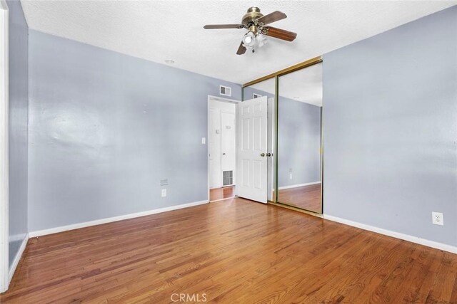 21032 Baltar St, Canoga Park, CA 91304 - unfurnished bedroom featuring wood finished floors, baseboards, a closet, and visible vents