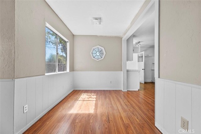 21032 Baltar St, Canoga Park, CA 91304 - spare room with a wainscoted wall and wood finished floors