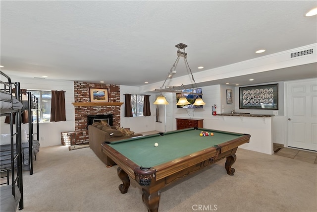 279 Bluebird Ct, Big Bear Lake, CA 92315 - recreation room featuring a textured ceiling, visible vents, a brick fireplace, billiards, and light colored carpet