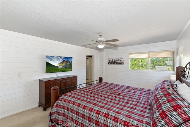 279 Bluebird Ct, Big Bear Lake, CA 92315 - bedroom featuring light carpet, ceiling fan, and a textured ceiling