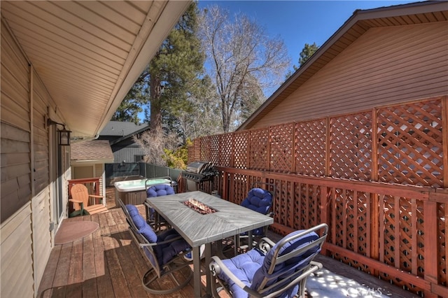 279 Bluebird Ct, Big Bear Lake, CA 92315 - wooden terrace with a hot tub, outdoor dining area, fence, and grilling area